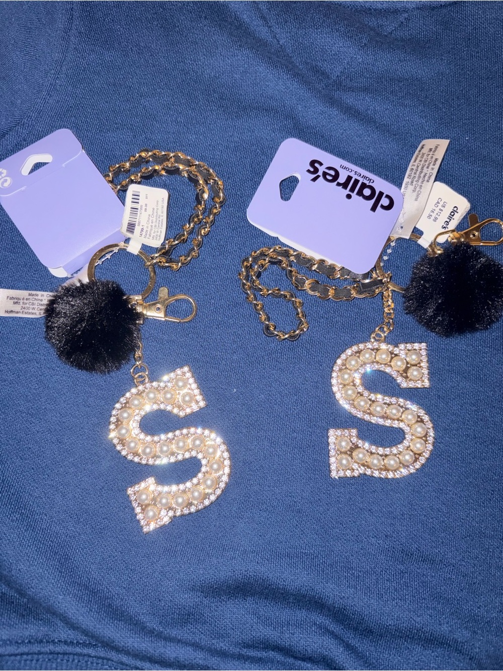 Claire's Gold Pearl 'S' Keychain with Black Pom-Pom Charm